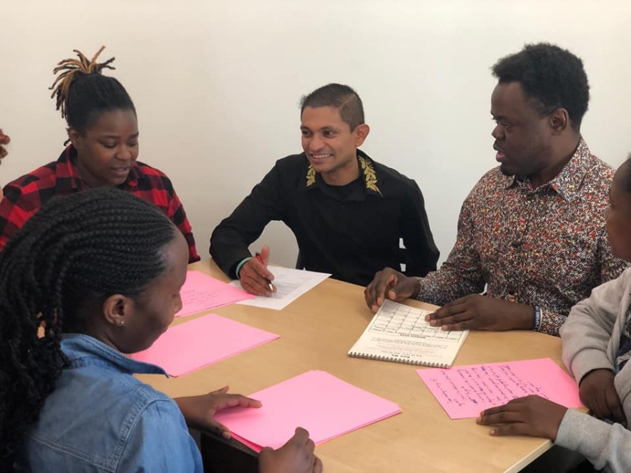 People in a meeting around a table